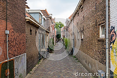 One of the oldest narrow alleys in the center of Delft, near the Stock Photo