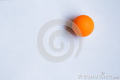 One orange ping pong ball on white background. Stock Photo