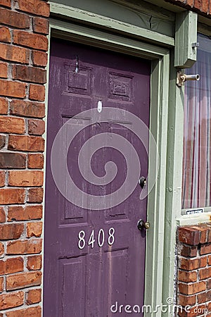 One outdoor purple wooden door Stock Photo