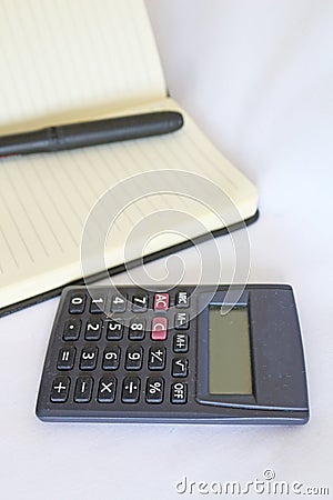 One pencil, notebook and a calculator Stock Photo