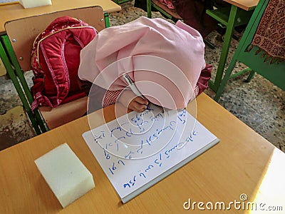 One of the primary school girls in Rasht, Guilan province, Iran. An Islamic school where girls should wear scarves and dress Editorial Stock Photo