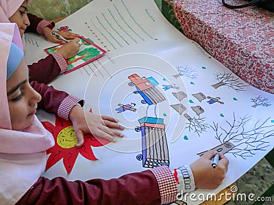 One of the primary school girls in Rasht, Guilan province, Iran. An Islamic school where girls should wear scarves and dress Editorial Stock Photo