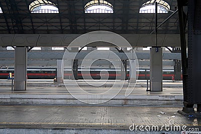 Milan, Central Station. 12/22/2016. The almost empty station is a red arrow train Editorial Stock Photo