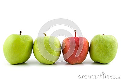 One red apple among green apples Stock Photo