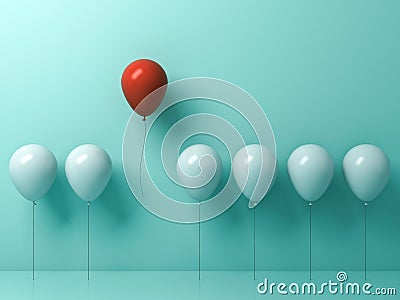 One red balloon flying away from other white balloons on light green pastel color Stock Photo