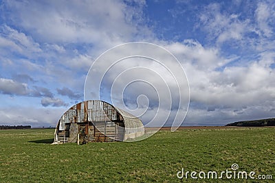 The one and only remaining small Aircraft Hanger now used for Farm storage at RAF Stracathro. Stock Photo