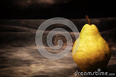One ripe bosc pear on gray studio backdrop Stock Photo