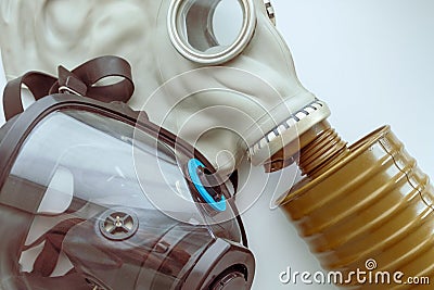 One rubber another with panoramic glass two gas masks are next to a white background Stock Photo