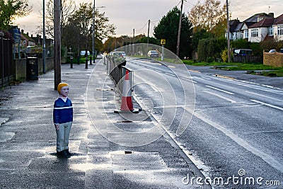 One of several creepy child-shaped bollards in Iver Editorial Stock Photo