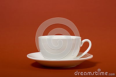 One simple coffee cup on brown color background, closeup photo Stock Photo