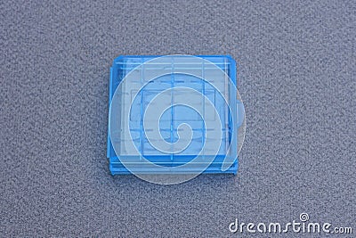 A one small closed square blue plastic box Stock Photo