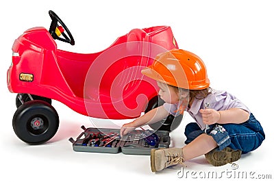 One small little girl playing with toy car. Stock Photo