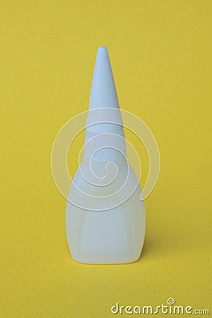 one small white closed plastic tube with glue Stock Photo