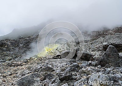 A fumerole with sulfur deposit on Mt. Sibayak, Indonesia. Stock Photo