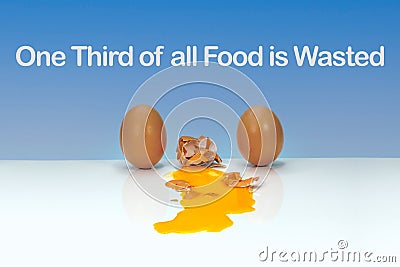 One third of all food is wasted text, 3 eggs Stock Photo
