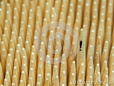 One toothpick with an exclamation mark is taller than a lot of others Stock Photo