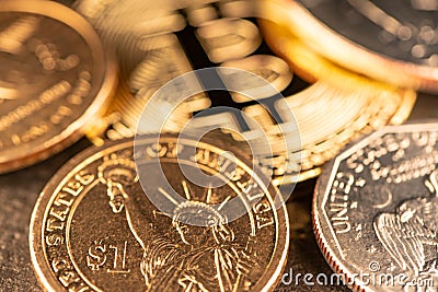 One US Dollar coin with Gold Bitcoin out of Focus. Digital Crypto Currency trading to USD Editorial Stock Photo