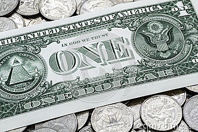 One USA Dollar Bill On A Pile Of Quarters Stock Photo