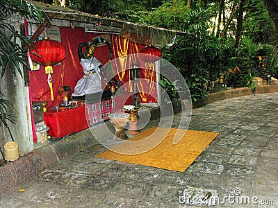 One of the vials in the gardens with the Goddess of Nature at Wat Sam Phran Temple Editorial Stock Photo