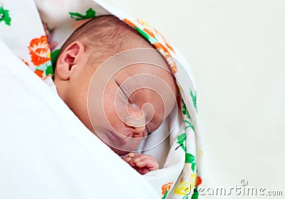 One week old baby boy asleep Stock Photo