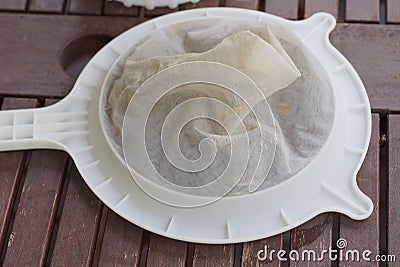 One white round plastic sieve Stock Photo