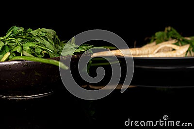 White parsley root on black glass Stock Photo