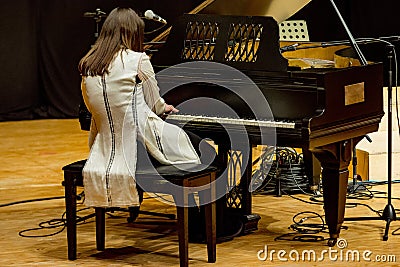 One woman plays piano in a concert Editorial Stock Photo