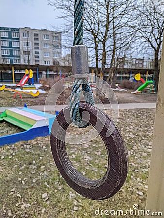 one wooden gymnastic ring on the playground Stock Photo