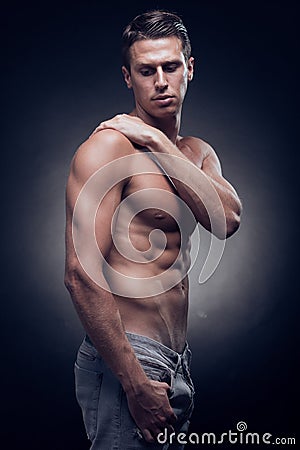 One young adult man, Caucasian, fitness model, muscular body, sh Stock Photo