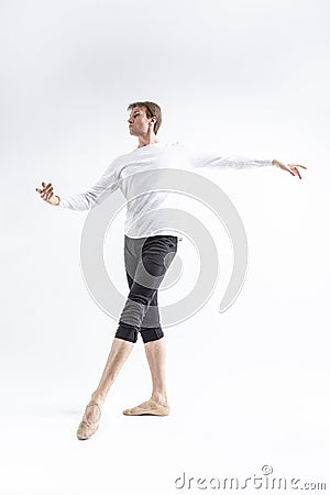 One Young, Handsome, Sporty Athletic Ballet Dancer with Ballanced Hands on White Stock Photo
