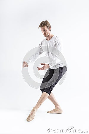 One Young, handsome, sporty and athletic ballet dancer with Ballanced Hands on White Stock Photo