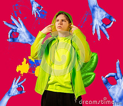 One young man in bright clothes surrounded by blue female hands. Surreal collage Stock Photo