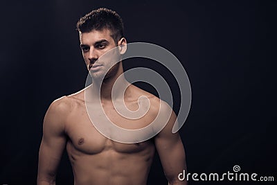 One young man, looking sideways, reflectors shirtless body Stock Photo