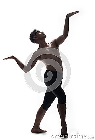 One young man, shirtless topless, ballet dancer, arms hand raised up, standing posing like statue, l Stock Photo