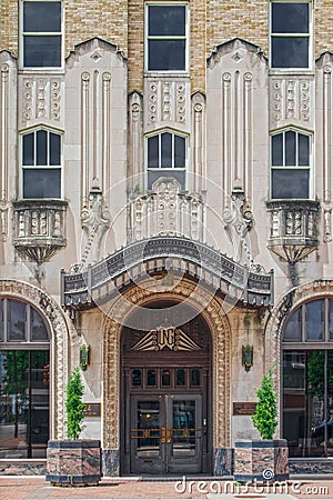 ONG Building - One of the first zigzag art deco style buildings in Tulsa with hanging ornate entrance canopy and pink Editorial Stock Photo