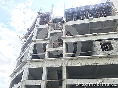 An Ongoing Construction Site front elevation view of Skeleton or Framed Structure consists of Columns Slab Beams and Shuttering Stock Photo