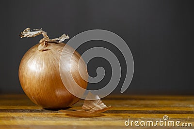 Onion on a cutting board with dark background Stock Photo