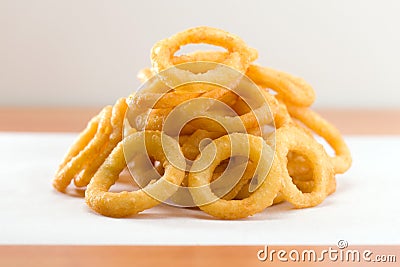 Onion ring on a waxed white paper Stock Photo