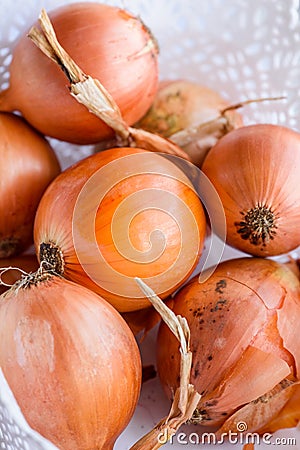 Fresh autumn crop onions. Big heap onions. Nature texture background Stock Photo