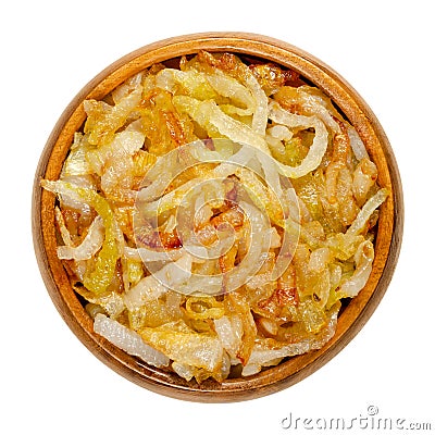 Onions, golden brown roasted, in a wooden bowl Stock Photo