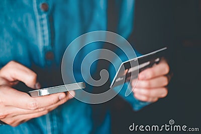 Online banking businessman using smartphone with credit card Fin Stock Photo