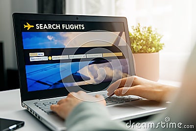Online booking - person using internet website in laptop for flight search and reservation Stock Photo