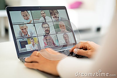 Online business conference screen in hands Stock Photo