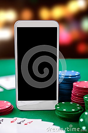 Online casino. Smartphone and chip cards Stock Photo