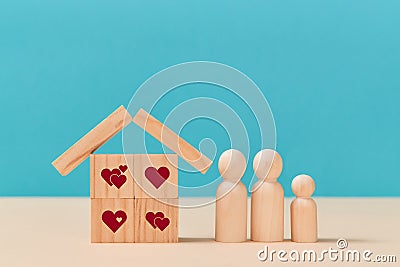 Online dating. Virtual love. Creating family. Love relationship. House of wooden cubes with heart signs, family members Stock Photo