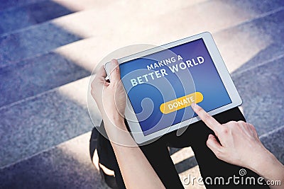 Online Donation Concept. Woman using Digital Tablet to making Do Stock Photo