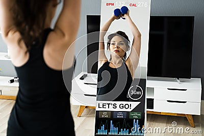 Fitness Exercise At Home Using Smart Mirror Stock Photo
