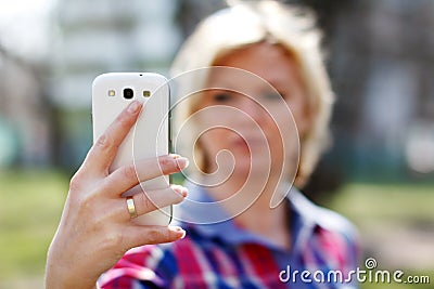 Online flirt by smartphone Stock Photo