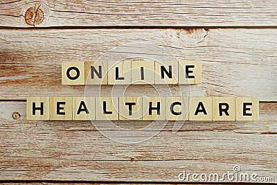 Online Healthcare word alphabet letters on wooden background Stock Photo