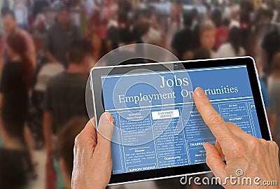 Online job hunting Hands with computer tablet reading employment ads infront of crowd of people Stock Photo